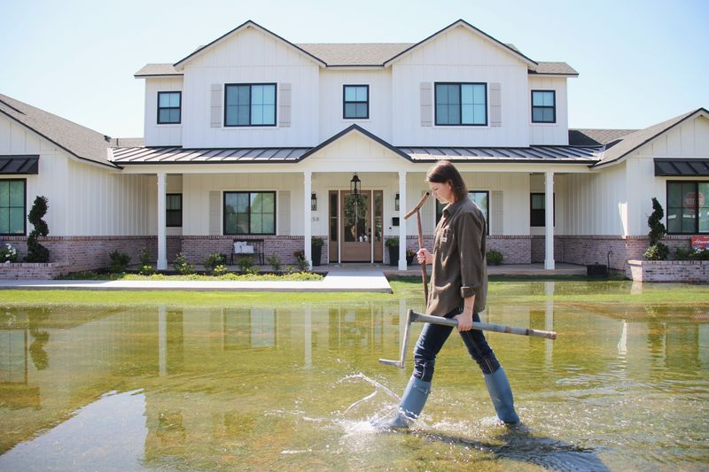 Walking in front of a flood-irrigated home in Arizona — verify water rights before you offer